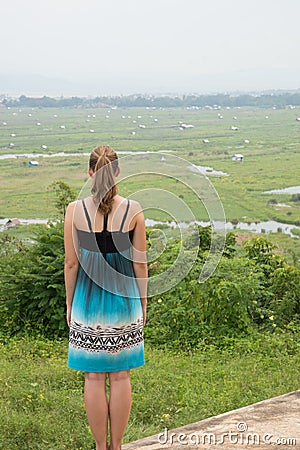 Young woman overlooking inle lake area in central myanmar Editorial Stock Photo