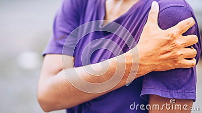 Young woman pain left shoulder Stock Photo