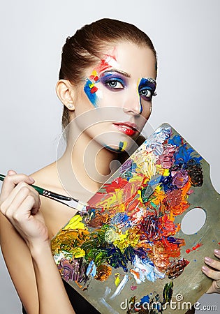 Young woman painter with color palette and paint brush Stock Photo