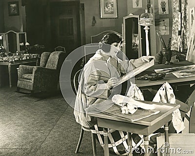 Young woman painting at home Stock Photo