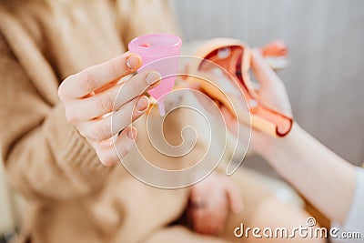 Young woman patient with a senior gynecologist during the consultation in the gynecological office Stock Photo