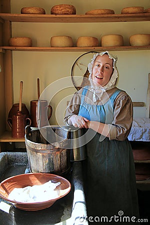 Young woman in period dress, reenacting life of a pilgrim,Old Sturbridge Village,Massachusetts,September,2014 Editorial Stock Photo