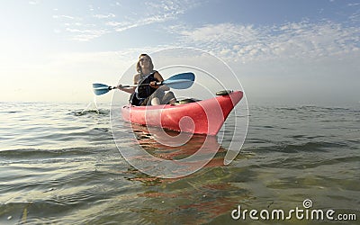 Young woman in pink kayak Stock Photo