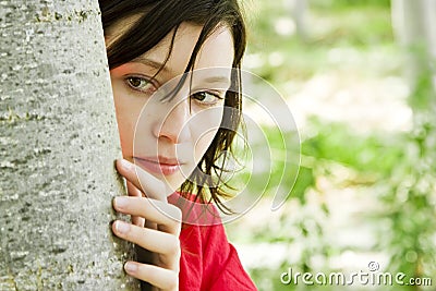 Young woman playing hide and seek Stock Photo