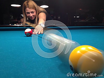 Young woman playing pool Editorial Stock Photo