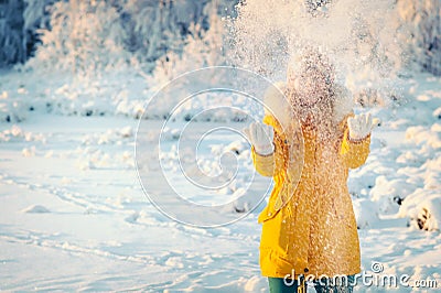 Young Woman playing with snow Outdoor Winter Lifestyle Stock Photo