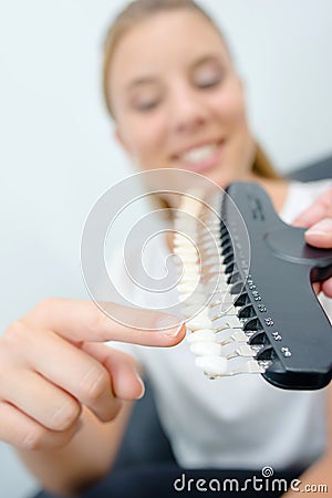 Young woman pointing at item Stock Photo