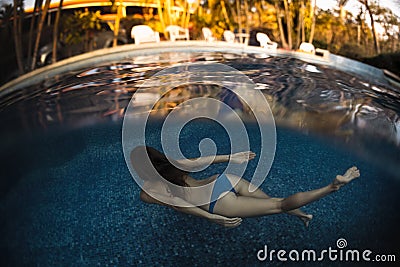 Young woman in the pool Stock Photo