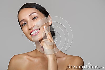 Young woman portrait. Bare shoulders. The hand touches the face Copycpase Stock Photo