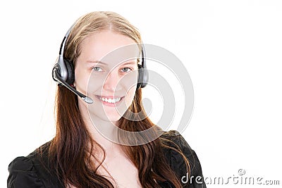 Young woman portrait in call center of an advertiser with telephone headset smiling and pleasant Stock Photo