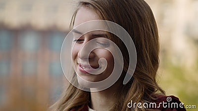 Young woman portrait at city street. Closeup natural beauty face woman smiling Stock Photo