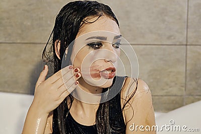 Young woman portrait with dripping smeared makeup Stock Photo