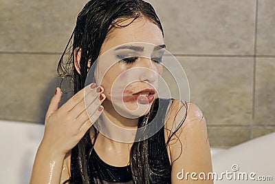 Young woman portrait with dripping smeared makeup Stock Photo