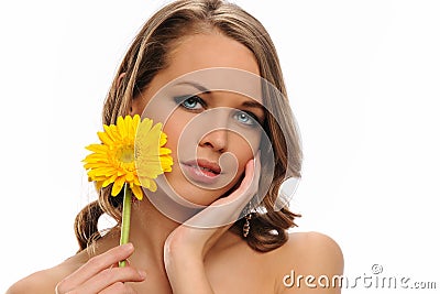 Young Woman portrait holding a yellow flower Stock Photo