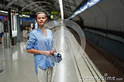 Young woman portrait inside metro subway Stock Photo