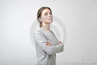 The young woman portrait with proud and arrogant emotions on face. Stock Photo