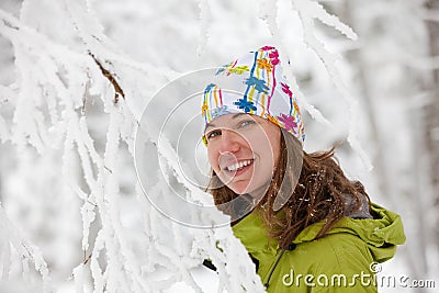 Young woman posing at camera in winter mountains Stock Photo