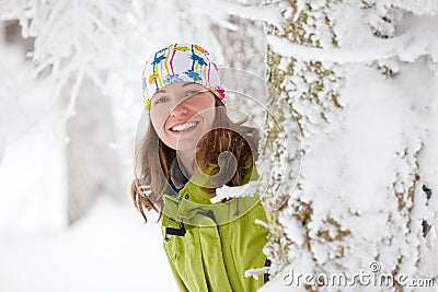 Young woman posing at camera in winter mountains Stock Photo