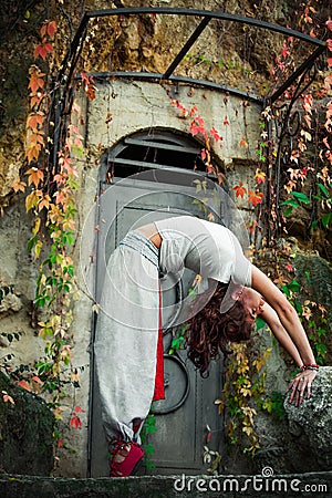 Young woman practice yoga outdoor autumn day Stock Photo