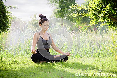 Young woman practicing yoga Everyday Yoga helps in concentration Stock Photo