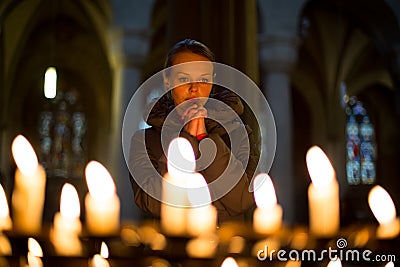 Young woman prays Stock Photo