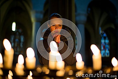 Young woman prays Stock Photo