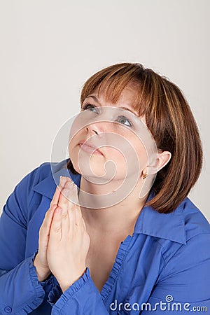 The young woman prays to god Stock Photo