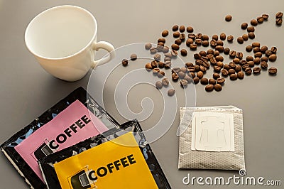 Young woman preparing a modern filter coffee in a drip bag at home. Step 2: Open drip bag Stock Photo