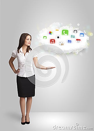 Young woman presenting cloud with colorful app icons and symbols Stock Photo