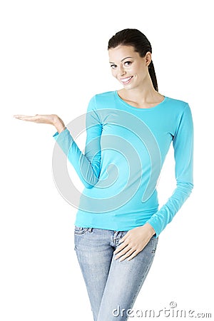 Young woman presenting copy space on her palm Stock Photo