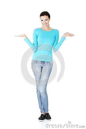 Young woman presenting copy space on her palm Stock Photo