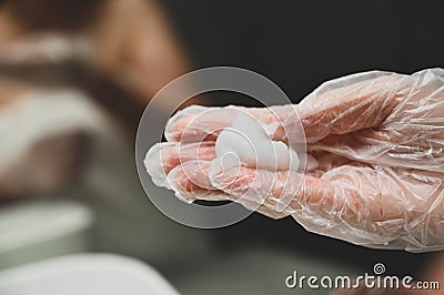 A young woman puts a healing mask on her hair at home Stock Photo