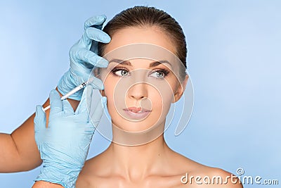 Young woman receiving BOTOX injections Stock Photo