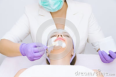 Young woman receiving facial treatment Stock Photo