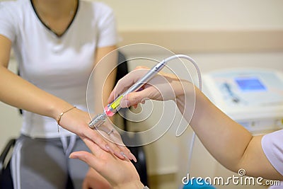 Young woman receiving laser therapy Stock Photo