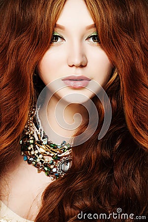 Young Woman. Redhead, Long Curly Hair and Makeup Stock Photo