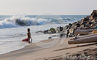 Young woman relaxing on the Arabian sea shore Editorial Stock Photo