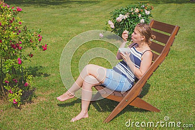 Young woman relaxing and eating ice cream Stock Photo