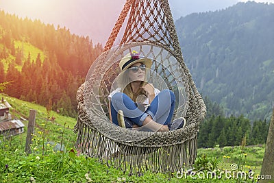 A young woman resting in a hammock in Pokut Plateau Stock Photo