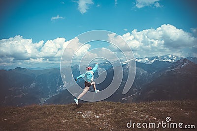 Young woman resting on a mountain hike Stock Photo