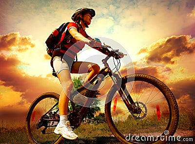 Young Woman riding bicycle Stock Photo