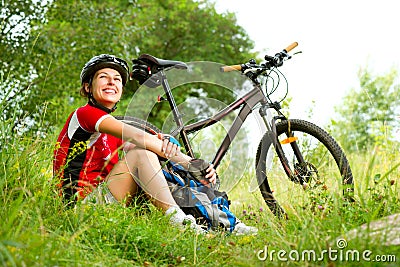 Young Woman riding bicycle Stock Photo