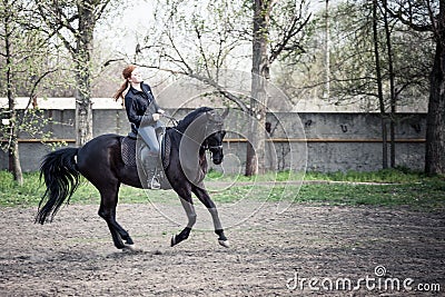 Young Woman Riding Horse Stock Photo