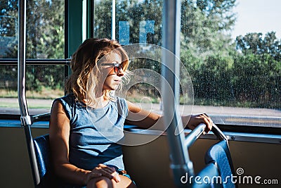 Young woman riding a public bus Stock Photo