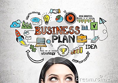 Young woman s head and a business plan Stock Photo