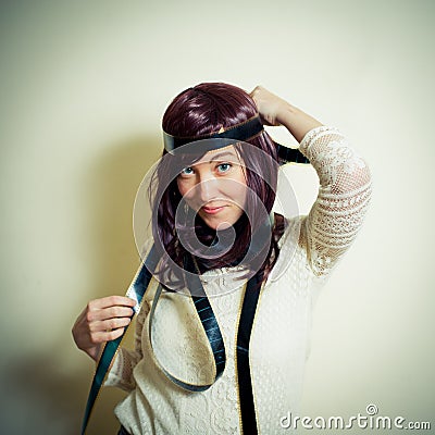 Young woman in 70s hippie style smiling and posing Stock Photo