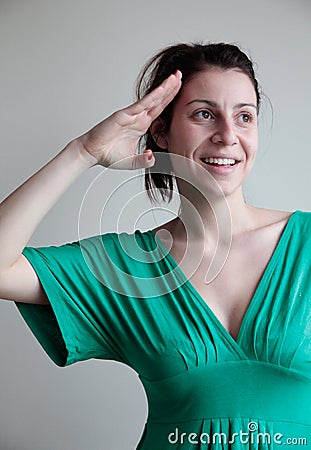 Young woman saluting Stock Photo