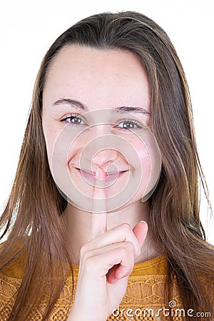 Young woman saying shh keeping secret happy Stock Photo