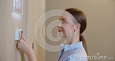 Young woman scan fingerprint on finger scan machine for office door opener Stock Photo