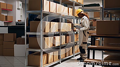 Young woman scanning barcodes on packages to work Stock Photo